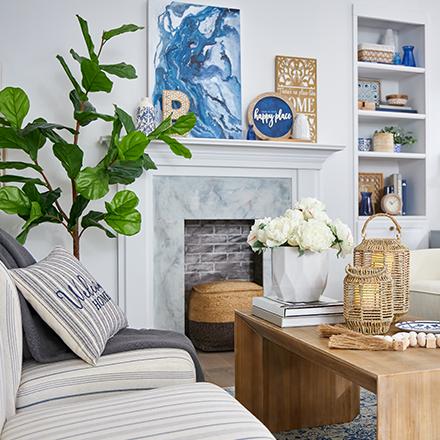 living room with blue accents and large tree
