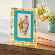 Photo of children in a picture frame for Mother's Day
