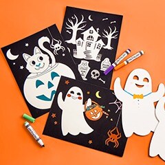 3 kids crafts, a ghost, pumpkin with cat and spooky house with markers on an orange background