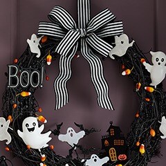 Black Halloween wreath with black and white bow, "boo!" and ghost