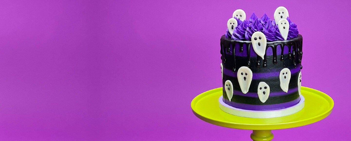 Hand decorate Halloween themed cake with fondant ghosts