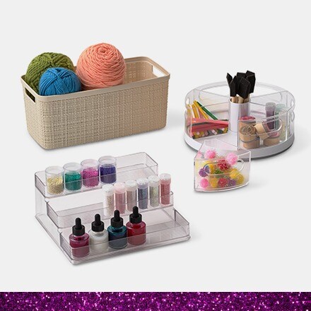 three types of plastic storage holding ink, yarn and stamps