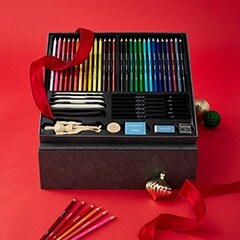 Art set in wood box sitting on table