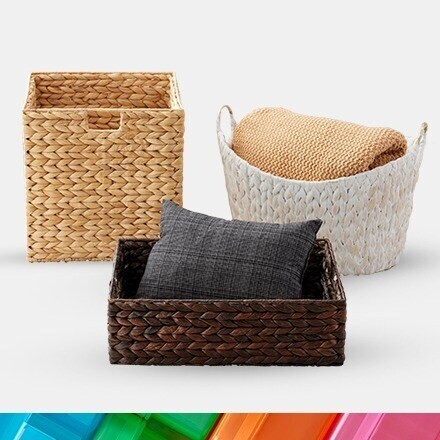 three water hyacinth baskets in white, brown and tan