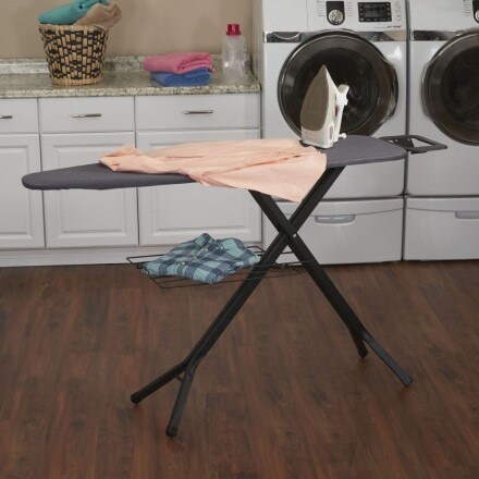 Black ironing table in a laundry room