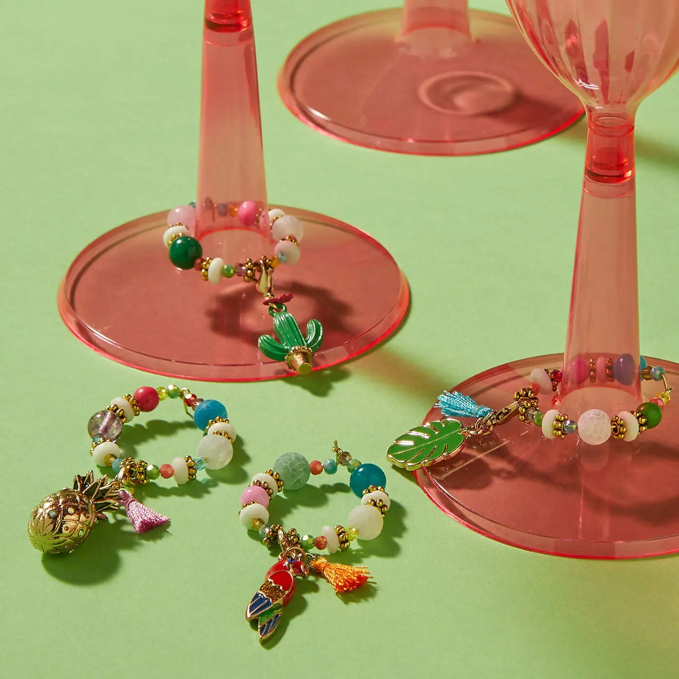tropical beads in circles around stem glasses
