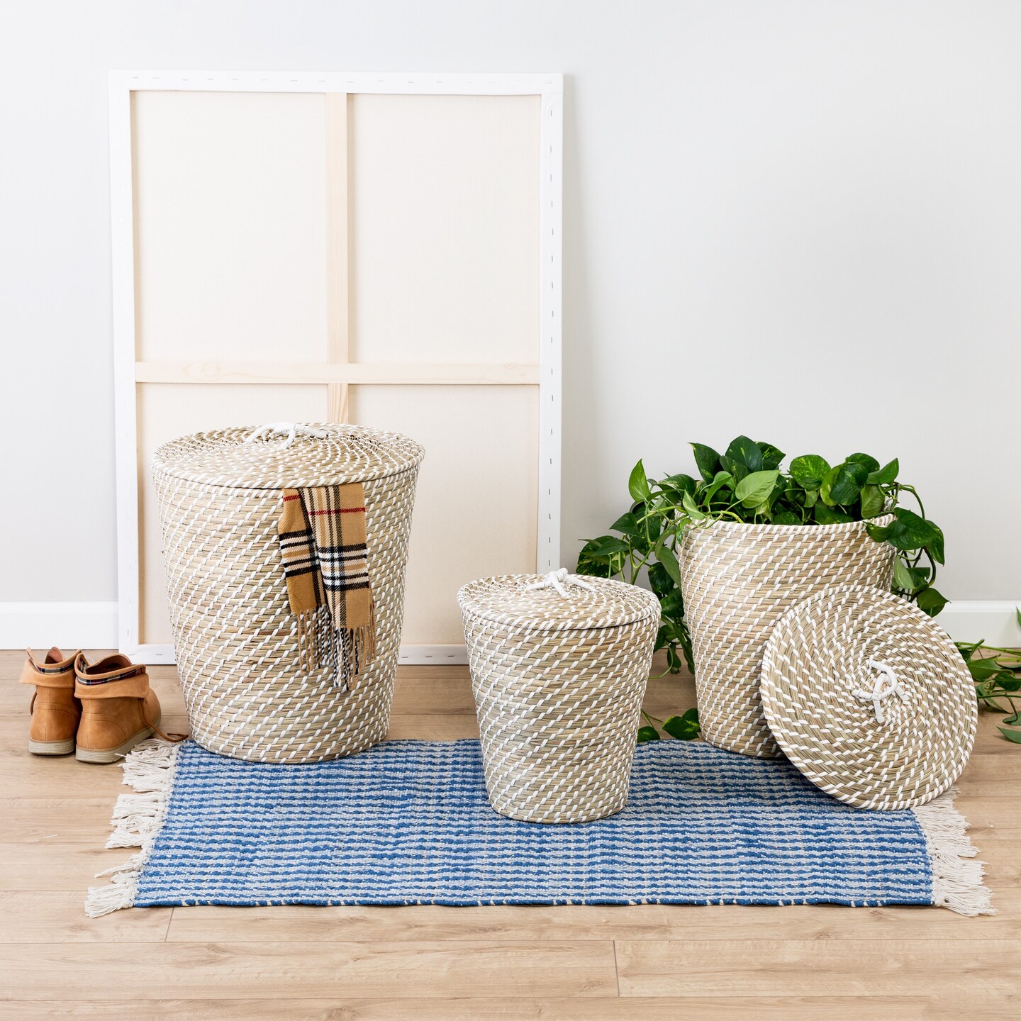 Soft woven baskets sitting on top of a blue rug