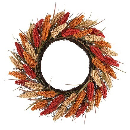 Floral wreath with small pumpkins, red and orange leaves and striped bow