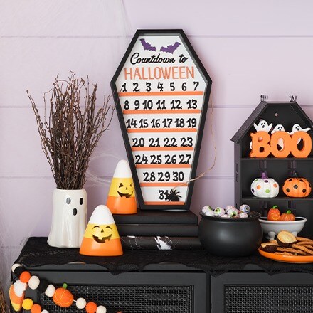 Hocus Pocus Collection: tabletop decorations in black and orange colors. Pumpkins, candy decorations, 31 day calendar, ghost decorations