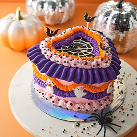Baking & Party Halloween inspired cake with some pumpkins and a decorative spider