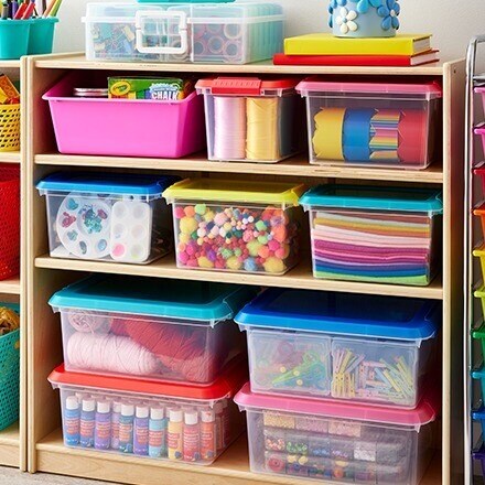 classroom shelves organized with storage bins
