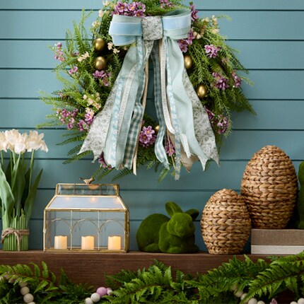 Easter Meadow decor collection inspired with natural grass eggs and greenery with a large wreath with a big blue bow