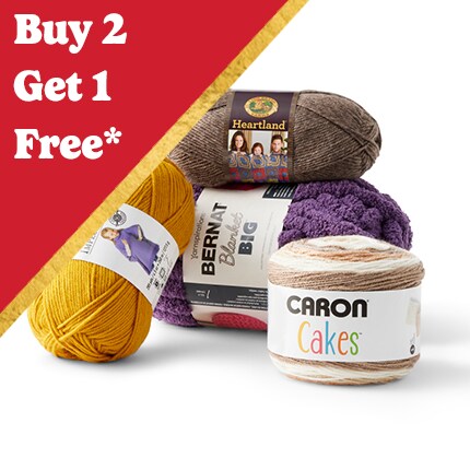assorted skeins of yarn with Buy 2 get 1 Free in white text over red triangle