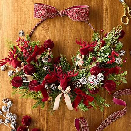 Christmas picks and wreath supplies on metal frame