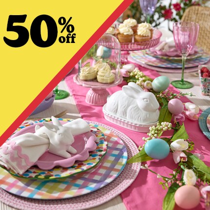 easter tablescape with 50% off in black text over yellow triangle
