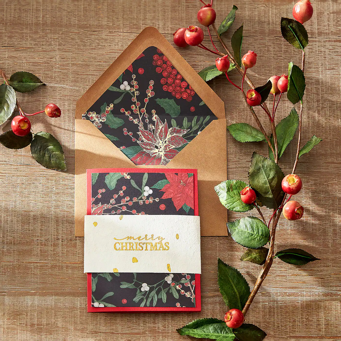 A christmas card with floral paper