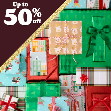 Gift boxes wrapped in multi colors of paper all stacked like wall paper