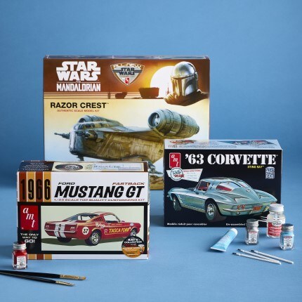 green model bronco suv on blue craft mat with assorted testor paint and accessories