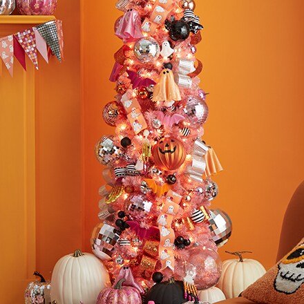 Pink halloween tree with bright colored ornaments