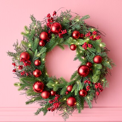wreaths with red ornaments