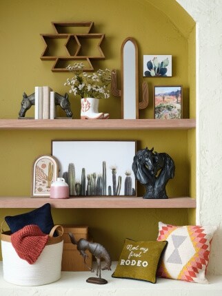 western styled décor on shelves with olive green wall