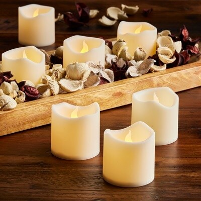 Multiple cream LED votives on mantle w/ potpourri