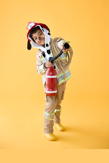 Boy in a Paw Patrol Fire fighter costume