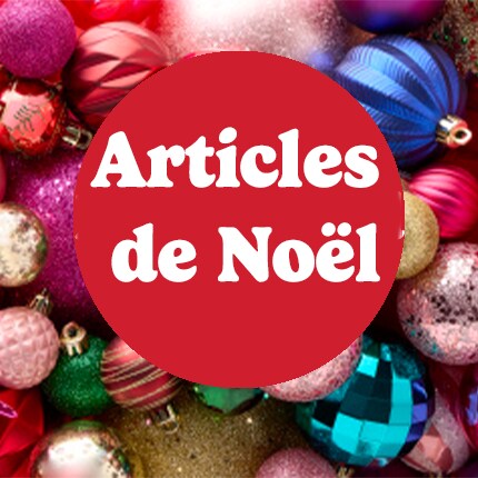 Noël en texte blanc sur une bulle rouge au-dessus d'un tas de décorations
