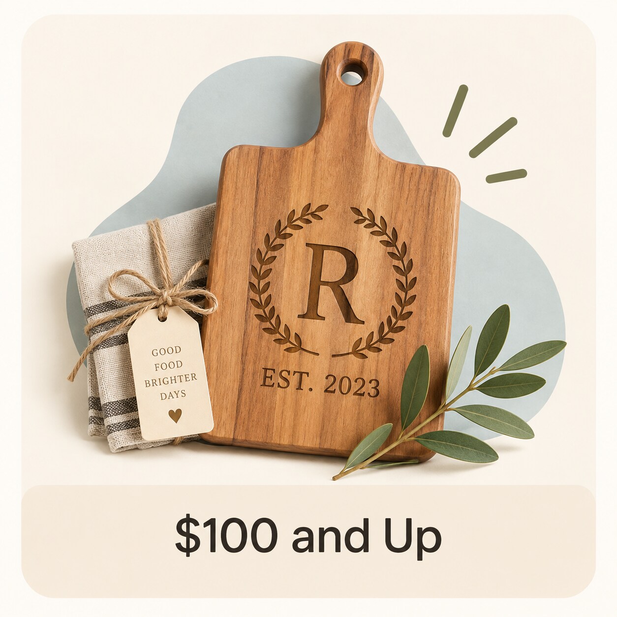 MakerPlace by Michaels Personalized wooden cutting board engraved with “R” and “EST. 2023,” decorated with leaves, priced at $100 and up; warm, elegant tone.