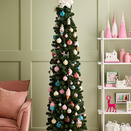 decorated Christmas tree covered in flocked ornaments