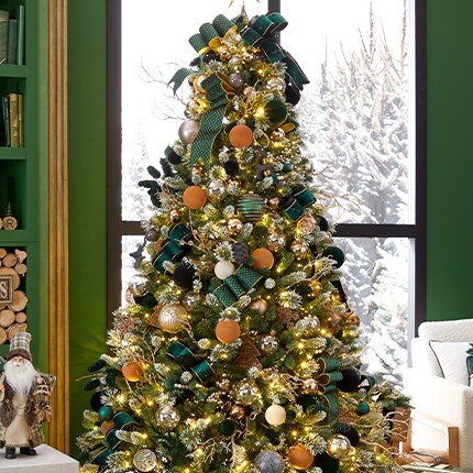 decorated Christmas tree covered in flocked ornaments