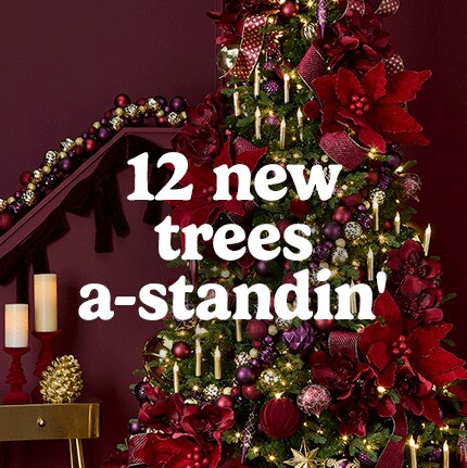 Festive Christmas scene with a decorated tree in red and gold ornaments, lit candles, and garlands. Text reads "12 new trees a-standin'."