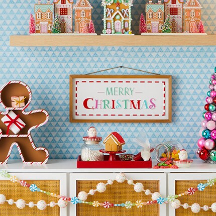 colorful holiday decorated shelves with blue wall