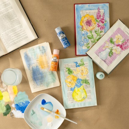 yellow, purple, green, & red craft paint bottles with flower painting