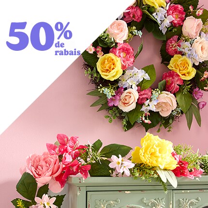 Easter wreath with floral and eggs and egg garland on a mantle 