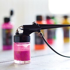 pink paint in airbrushing sprayer