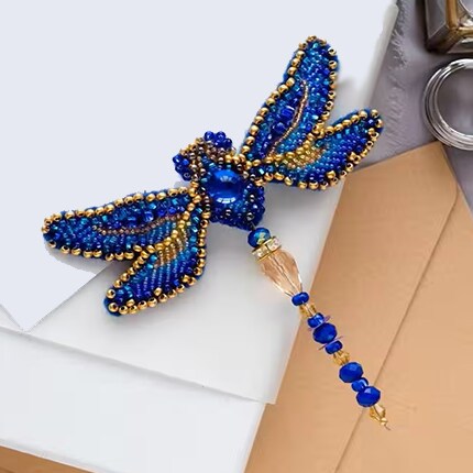 blue and gold bead dragonfly