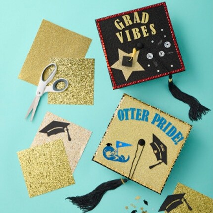 graduation hats with paper crafting artwork on top