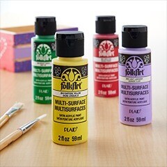 yellow, purple, green, & red craft paint bottles with flower painting