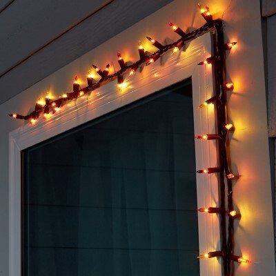orange string lights on the trim of door frame