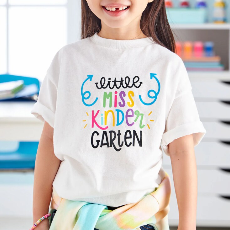 A child wearing a personalized tshirt for back to school