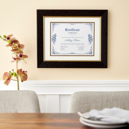 document frame on yellow wall