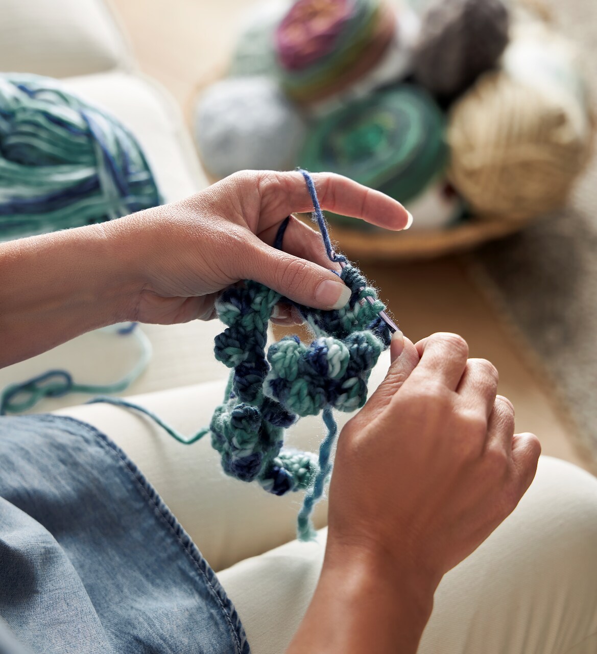 A woman's hands are crocheting