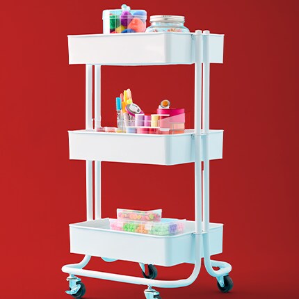 white rolling cart with blue background