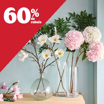 floral stems in clear glass vases with 60% off in white text over red triangle