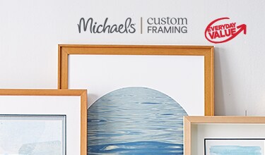 A bundle of frames placed against a wall.