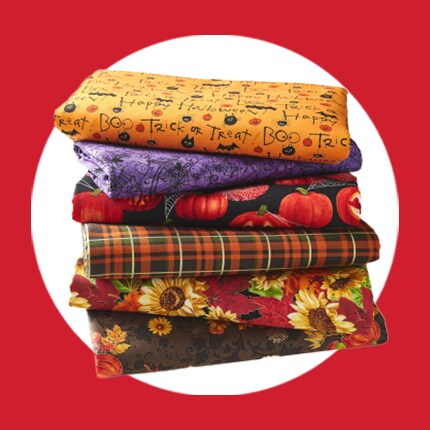stack of Halloween and fall themed fabric