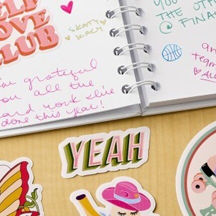 A journal with stickers and written notes.