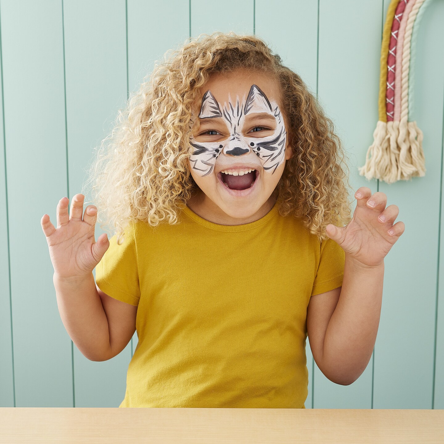 child with tiger face paint