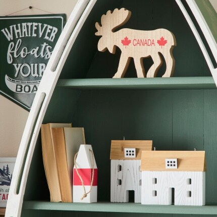 shelves with wood moose cutout and decorative house accents